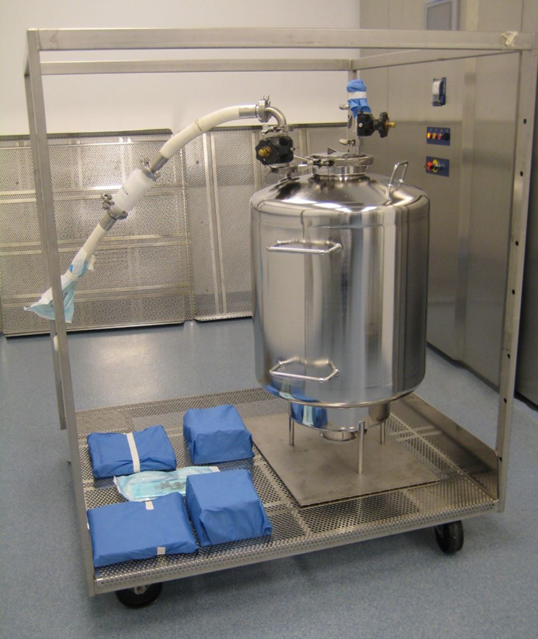 Stainless steel process tank and wrapped fill-machine components arranged on sterilization cart for steam sterilization load development study.