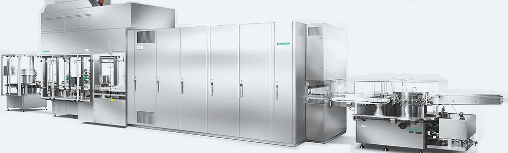 Continuous pharmaceutical depyrogenation tunnel with conveyor system and zoned heating and cooling sections for processing glass vials.