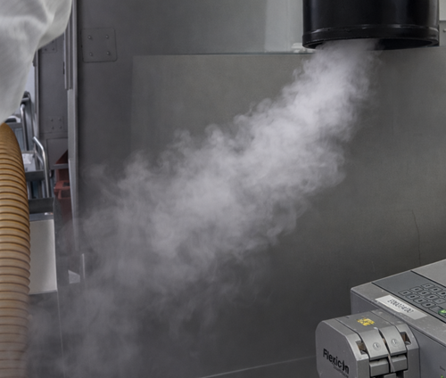 Airflow visualization demonstrating a local protection zone within an ISO 5 hood, with smoke directed to protect a defined critical area